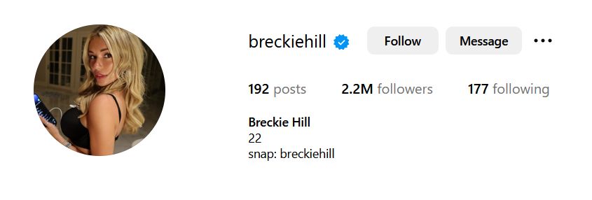 profile image of Breckie Hill holding a drink with long blonde hair