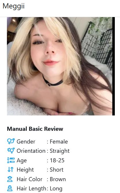 Meggii with two-tone hair, deep cleavage and cheeky smile