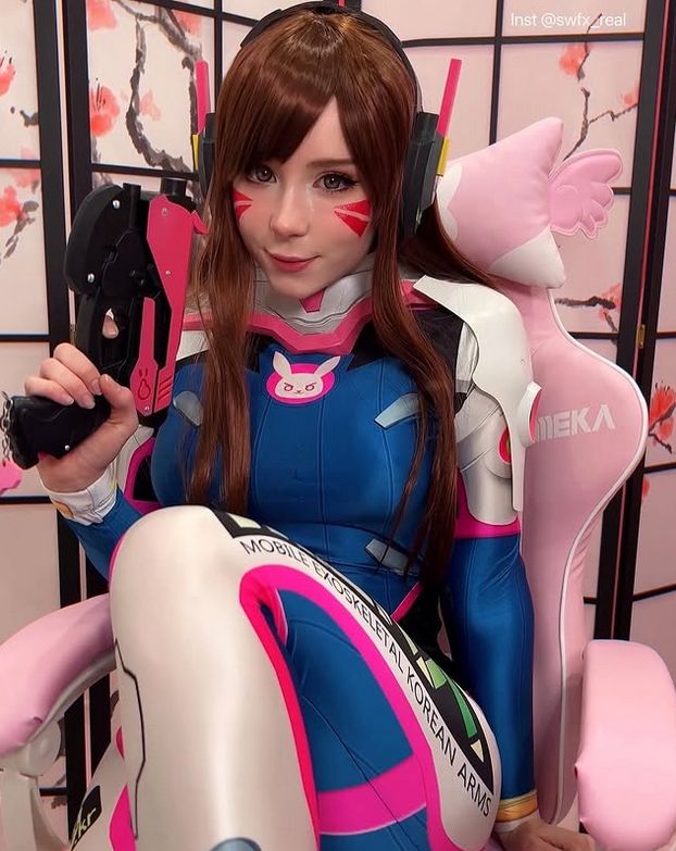 sweetie Fox in gamer-girl cosplay outfit with headset and pink chair